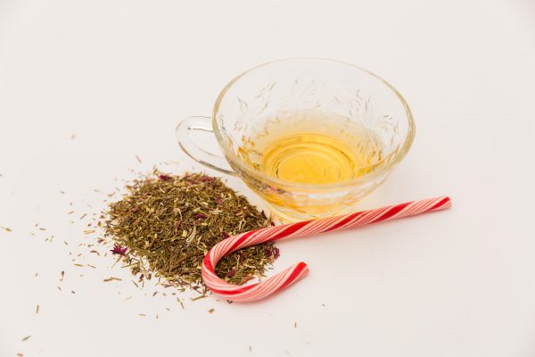 candy cane rooibos tea with a candy cane next to it